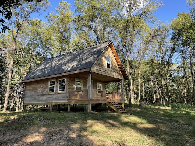 view of property exterior with a yard