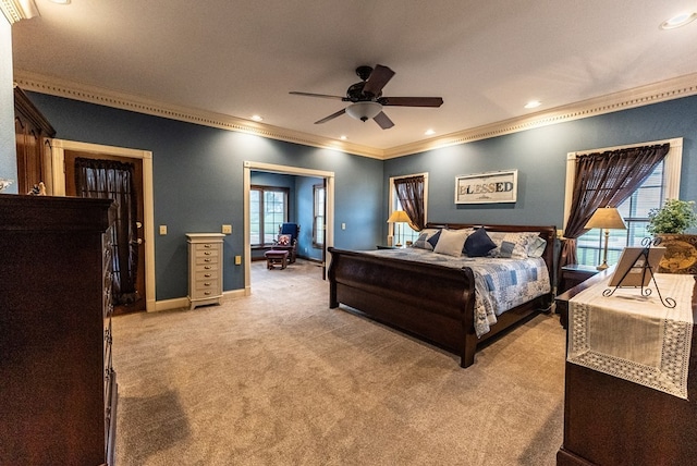 bedroom with ceiling fan, ornamental molding, and light carpet