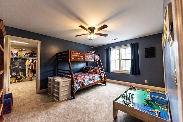 233 Nine Mile Cross Rd W, Pikeville, TN 37367 - carpeted bedroom featuring baseboards, ceiling fan, a walk in closet, and visible vents