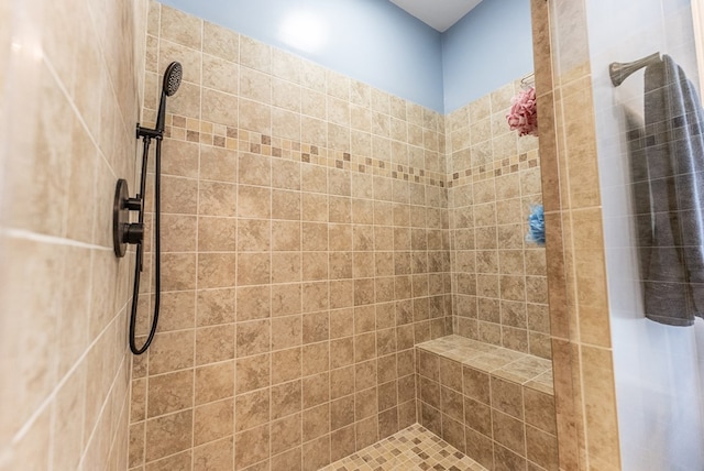 bathroom featuring tiled shower