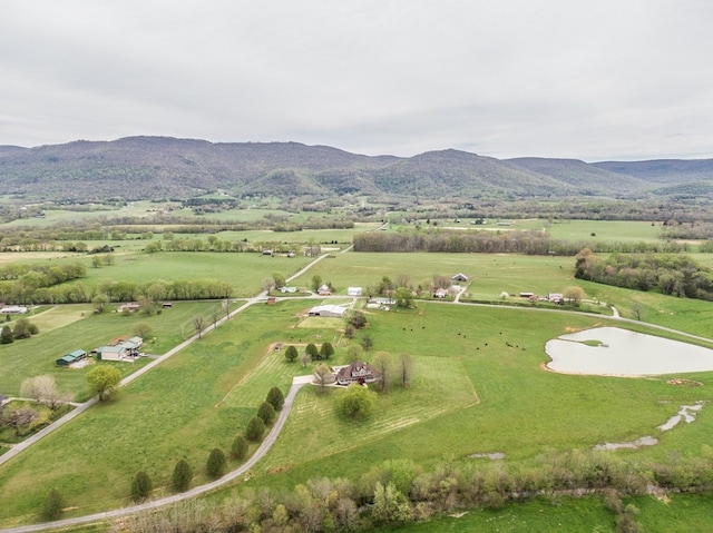 drone / aerial view featuring a mountain view and a rural view