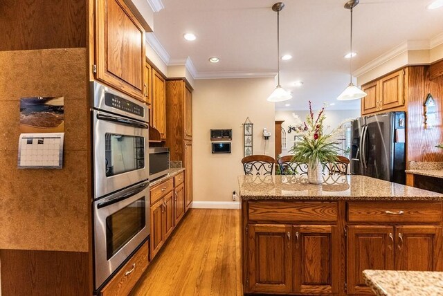 233 Nine Mile Cross Rd W, Pikeville, TN 37367 - kitchen with crown molding, stainless steel appliances, brown cabinets, and light wood finished floors