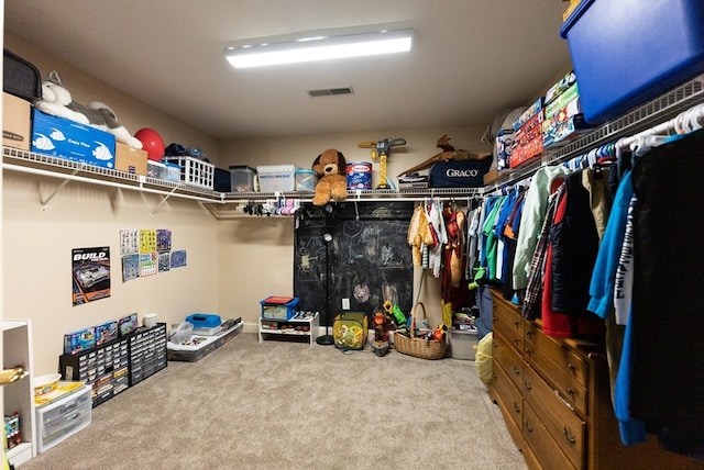 spacious closet with carpet floors