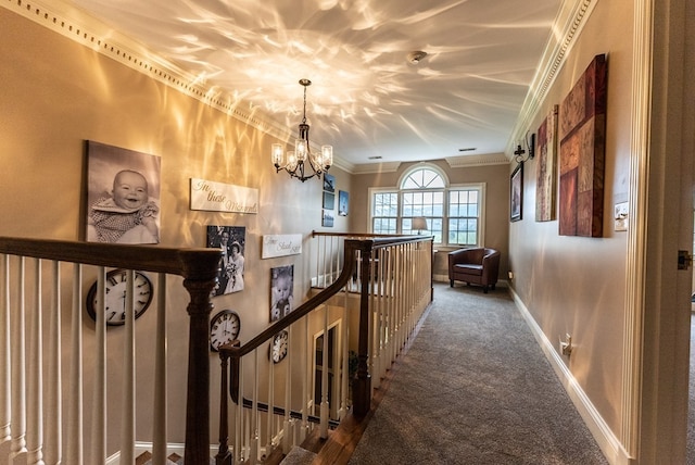 corridor with ornamental molding, carpet flooring, and a notable chandelier