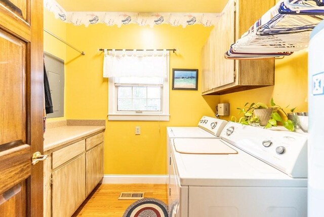 233 Nine Mile Cross Rd W, Pikeville, TN 37367 - washroom with visible vents, cabinet space, baseboards, light wood-style floors, and separate washer and dryer