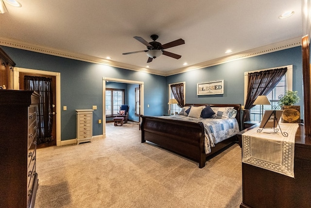 bedroom with ceiling fan, light colored carpet, and ornamental molding