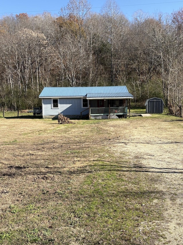 view of outdoor structure with a yard and a porch