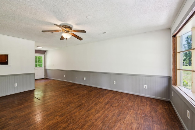 163 Longbranch Rd, Hohenwald, TN 38462 - empty room featuring wood finished floors, a ceiling fan, a textured ceiling, and a wainscoted wall