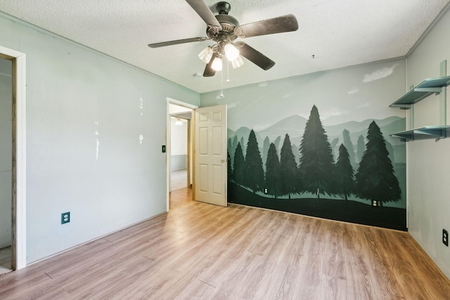 163 Longbranch Rd, Hohenwald, TN 38462 - empty room featuring wood finished floors, ceiling fan, and a textured ceiling