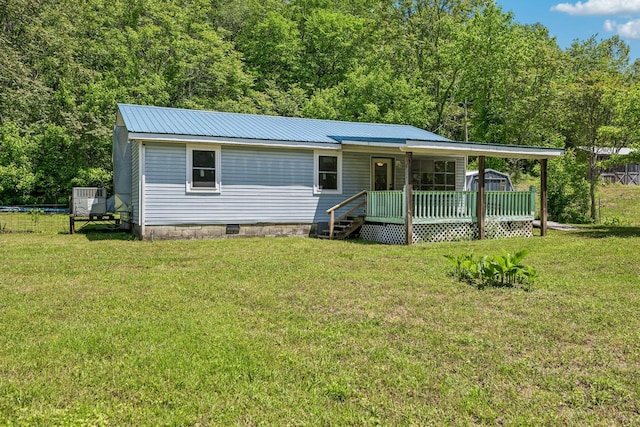 163 Longbranch Rd, Hohenwald, TN 38462 - view of front facade featuring a porch, a front lawn, and metal roof