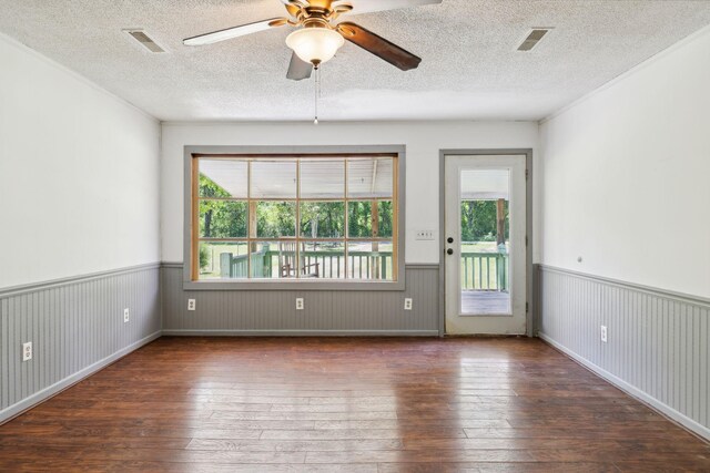 163 Longbranch Rd, Hohenwald, TN 38462 - unfurnished room featuring hardwood / wood-style flooring, a wainscoted wall, ceiling fan, and a textured ceiling