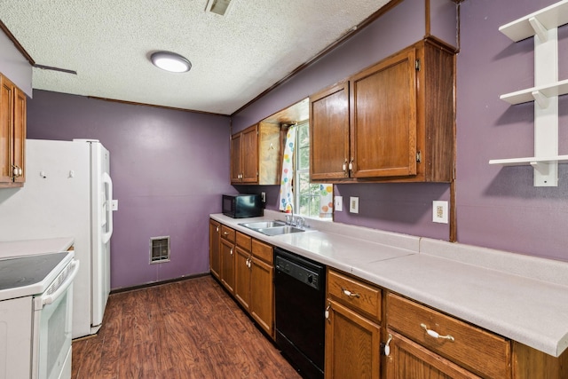 163 Longbranch Rd, Hohenwald, TN 38462 - kitchen with black appliances, brown cabinets, dark wood-style floors, a sink, and light countertops