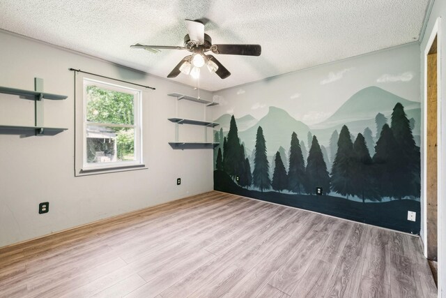 163 Longbranch Rd, Hohenwald, TN 38462 - spare room with wood finished floors, a textured ceiling, and a ceiling fan