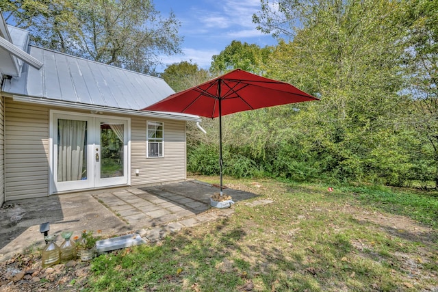 view of yard with french doors and a patio area