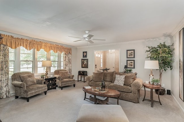 carpeted living room featuring ornamental molding and ceiling fan