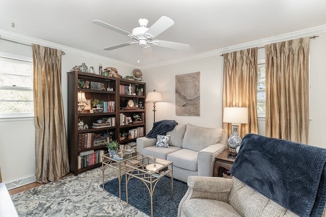 sitting room featuring crown molding, a wealth of natural light, and ceiling fan