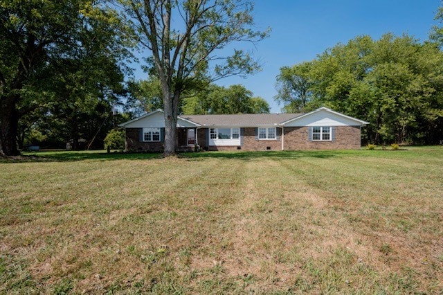 ranch-style house with a front lawn