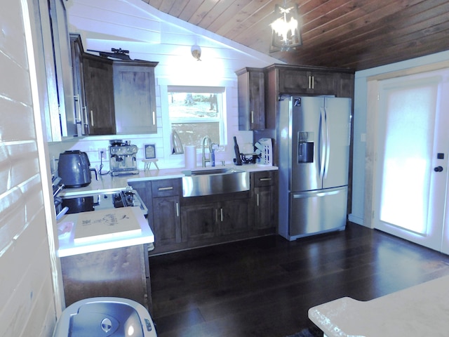 kitchen featuring sink, stainless steel appliances, vaulted ceiling, and a wealth of natural light