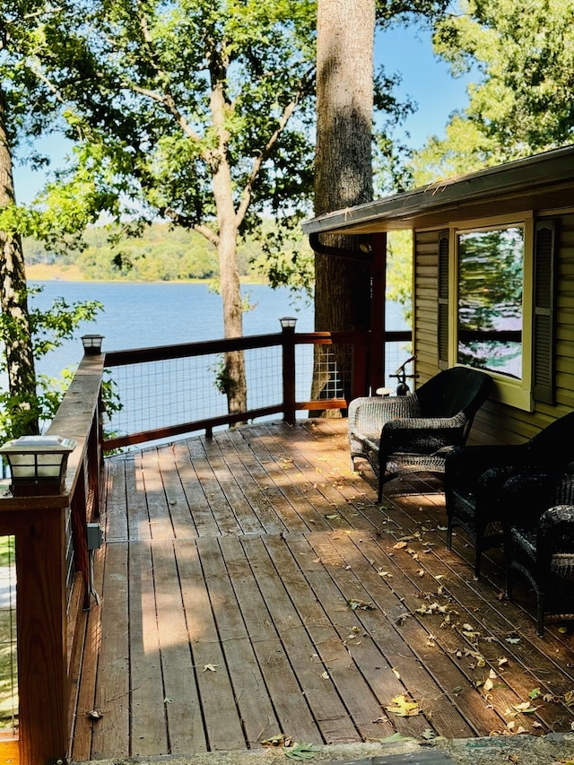 wooden deck with a water view