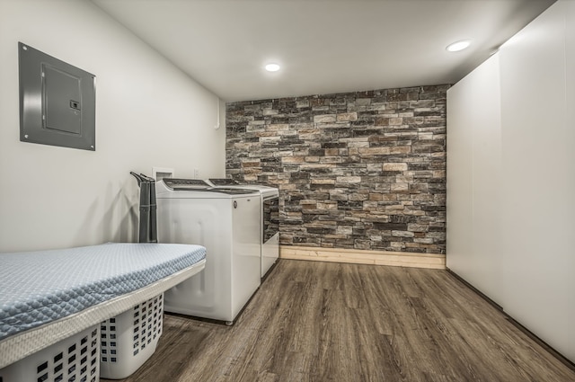 washroom featuring dark hardwood / wood-style floors, washer and dryer, and electric panel