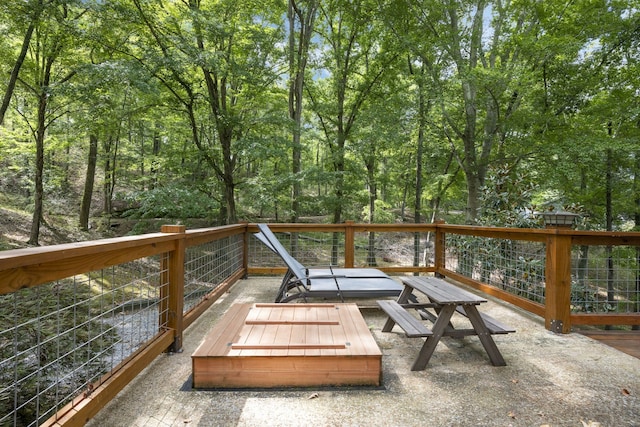 wooden terrace with an outdoor fire pit