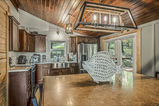 kitchen with wood ceiling, lofted ceiling, decorative light fixtures, wooden walls, and appliances with stainless steel finishes