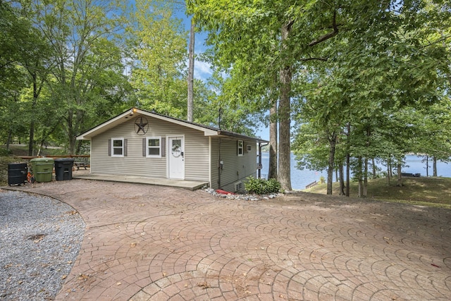 exterior space with a patio and a water view