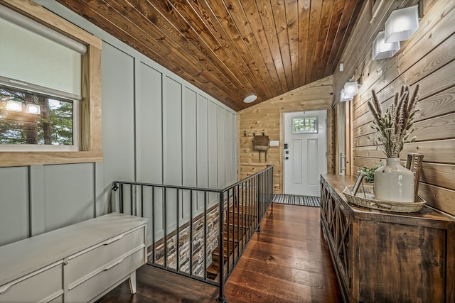 interior space featuring wood walls, wood ceiling, vaulted ceiling, and dark wood-type flooring