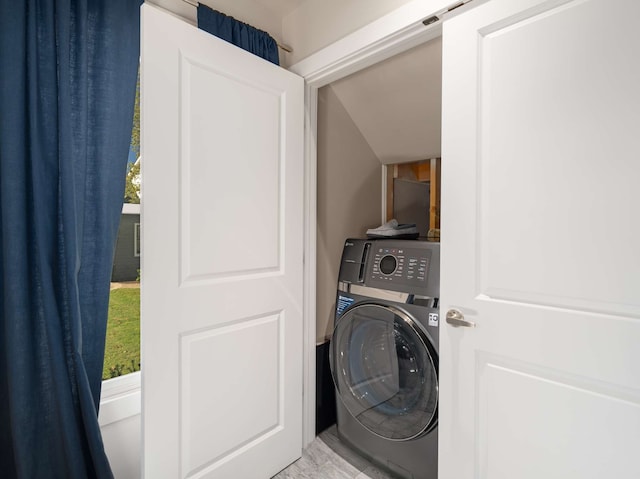 clothes washing area with washer / clothes dryer