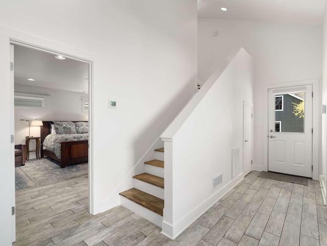 2310 Vaulx Ln, Nashville, TN 37204 - stairs with wood tiled floors, recessed lighting, and baseboards