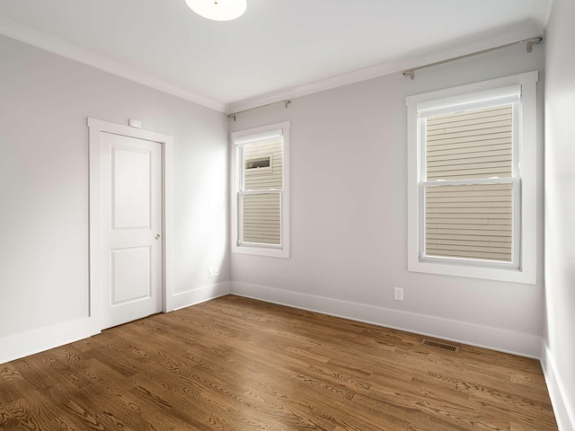 2310 Vaulx Ln, Nashville, TN 37204 - unfurnished room featuring wood finished floors, baseboards, and crown molding