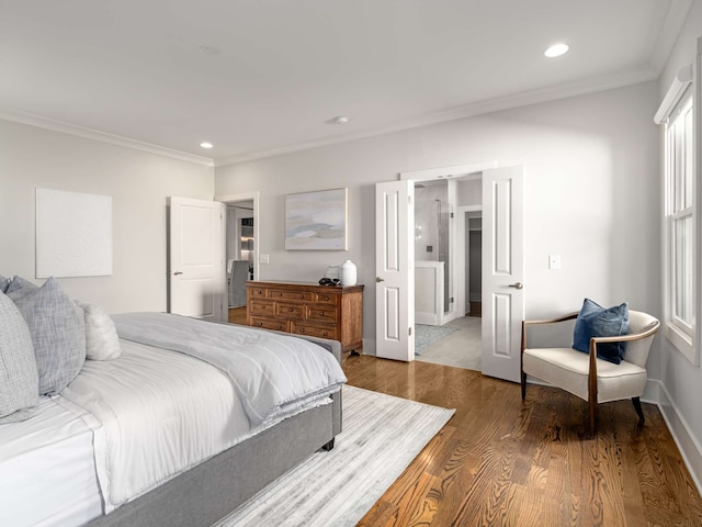 bedroom with crown molding and dark hardwood / wood-style floors