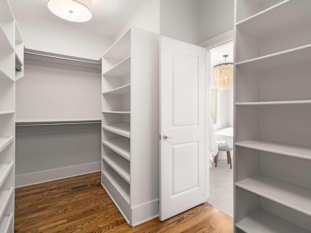 2310 Vaulx Ln, Nashville, TN 37204 - walk in closet featuring wood finished floors