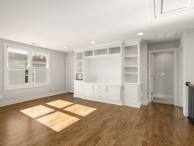 unfurnished living room featuring dark hardwood / wood-style floors