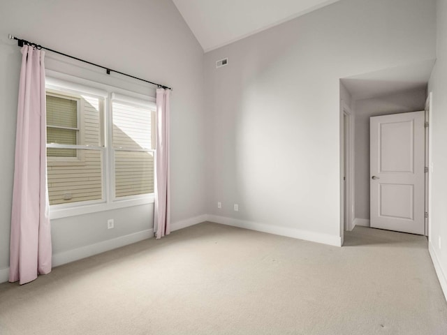 2310 Vaulx Ln, Nashville, TN 37204 - spare room with light colored carpet, vaulted ceiling, and baseboards