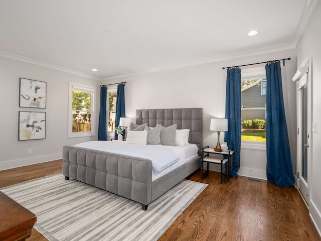 bedroom with hardwood / wood-style flooring and ornamental molding