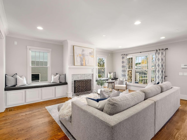 2310 Vaulx Ln, Nashville, TN 37204 - living area with a fireplace, ornamental molding, light wood finished floors, recessed lighting, and baseboards