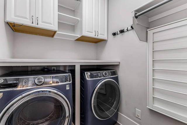 laundry area with cabinets and washing machine and dryer