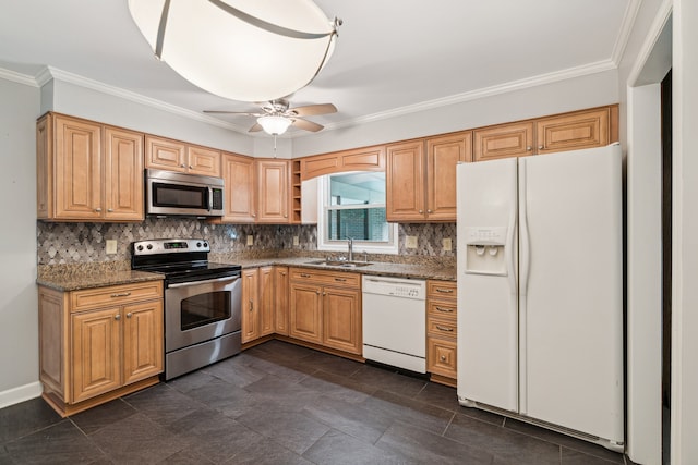 kitchen with dark stone countertops, appliances with stainless steel finishes, sink, ceiling fan, and ornamental molding