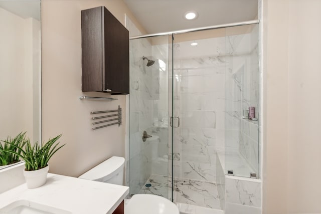 full bath with recessed lighting, a marble finish shower, toilet, and vanity