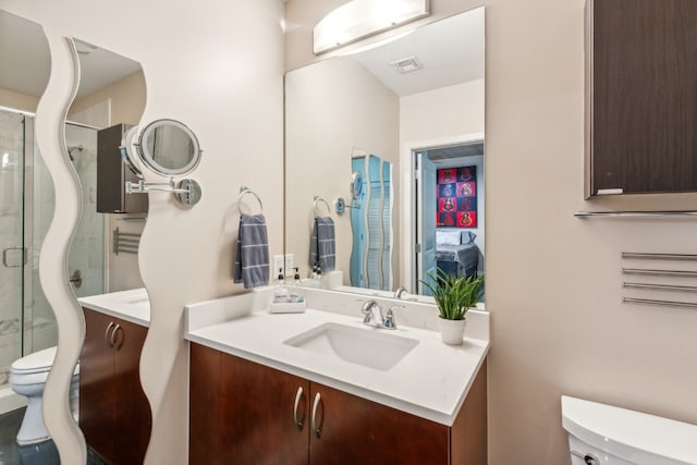 full bath featuring visible vents, a shower stall, toilet, and vanity