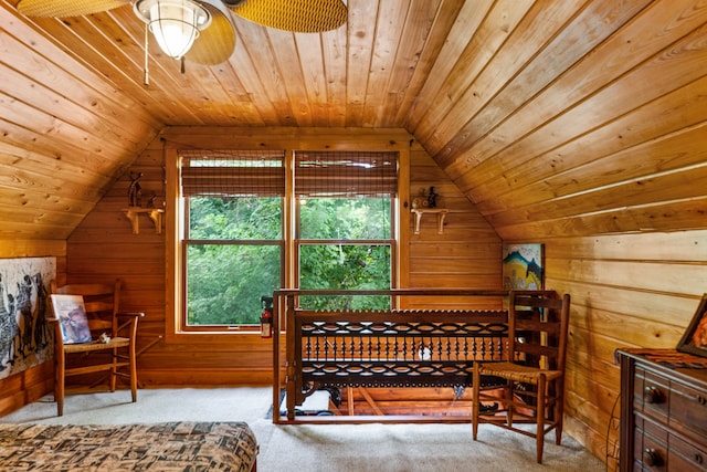 bedroom with wooden ceiling, lofted ceiling, wooden walls, and carpet