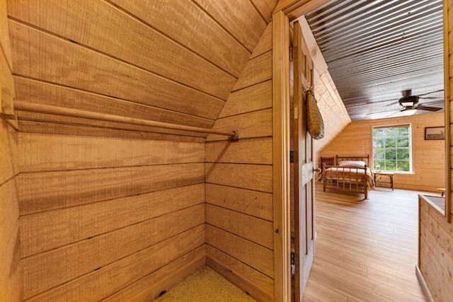 interior space with wood ceiling, wood walls, and hardwood / wood-style flooring