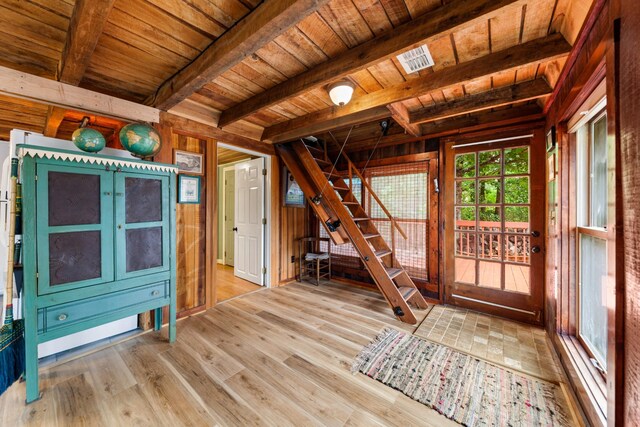 interior space featuring wood ceiling and beamed ceiling