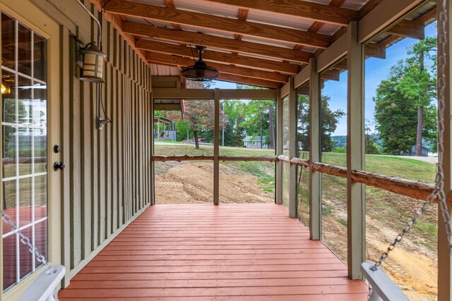 wooden deck featuring ceiling fan