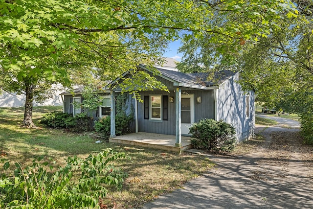 view of front of property with a porch and a front yard