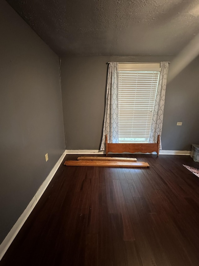 1694 Verona Caney Rd, Lewisburg, TN 37091 - spare room with baseboards, wood finished floors, and a textured ceiling