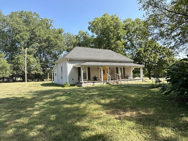 1694 Verona Caney Rd, Lewisburg, TN 37091 - view of front of house with covered porch, a front yard, and roof with shingles