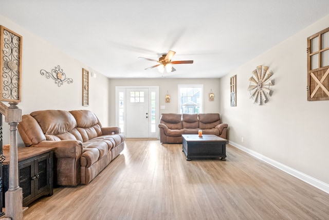 living room with ceiling fan and hardwood / wood-style floors