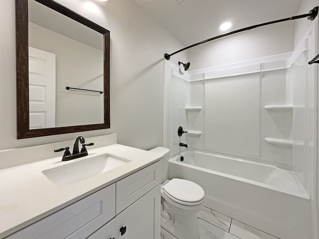 full bathroom with vanity, toilet, and washtub / shower combination